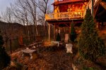 Fenced in yard area with firepit